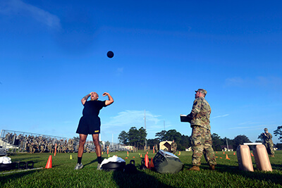 Cpl. Troy Perez, a fire team leader with the New York Army National Guard’s Alpha Company, 1st Battalion, 69th Infantry Regiment, heaves a 10-pound medicine ball during the first event of the competition. This portion of the event — called the Standing Power Throw — is part of the Army Combat Fitness Test, which made its debut in last year’s competition.